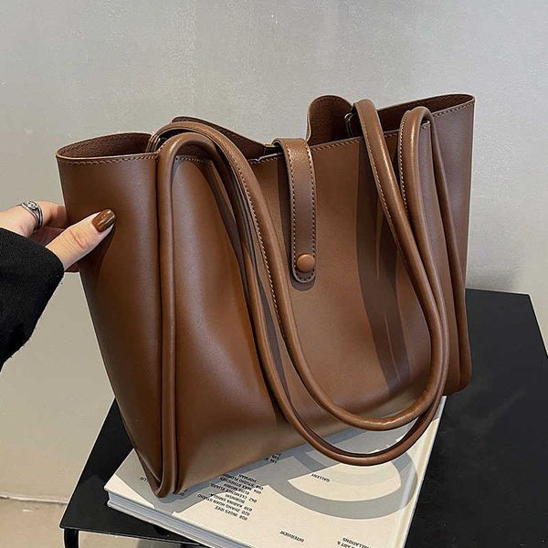 

hand net red 2022 fashion spring portable women's bag advanced sense large capacity commuter simple tote bag