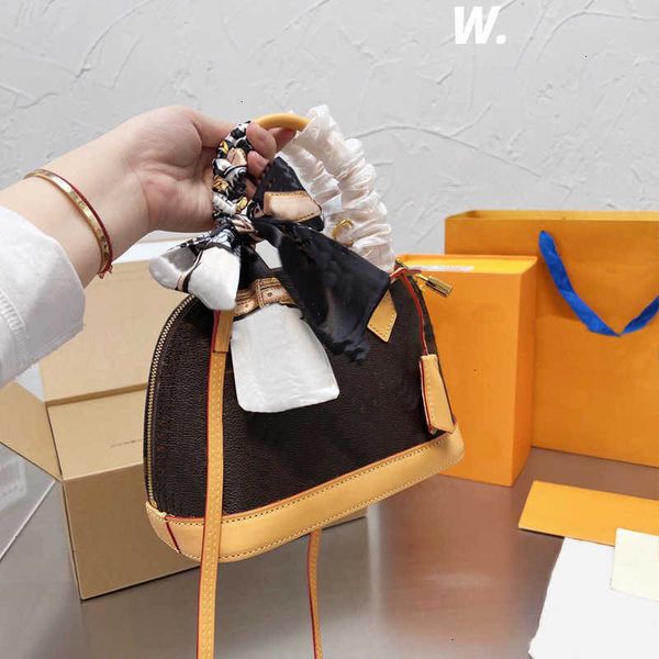 

designer bag handbag purse tote flower crossbody bags old high shell discolored bags twisted wire handle leather strap zipper closure