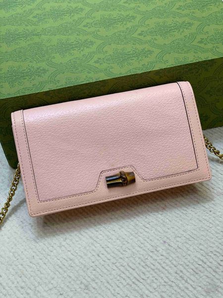 

2022design is a messenger bag printed embroidered flip canvas metal letters portable handbag