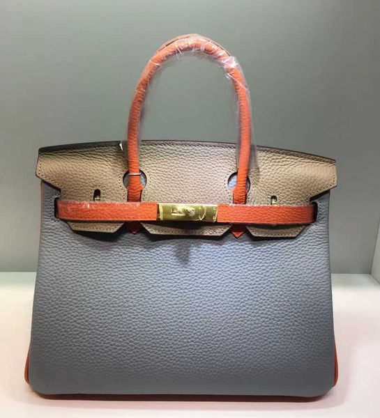 

sell designer bags on the 2023h new layer lychee cow leather color contrast hand cross body women's