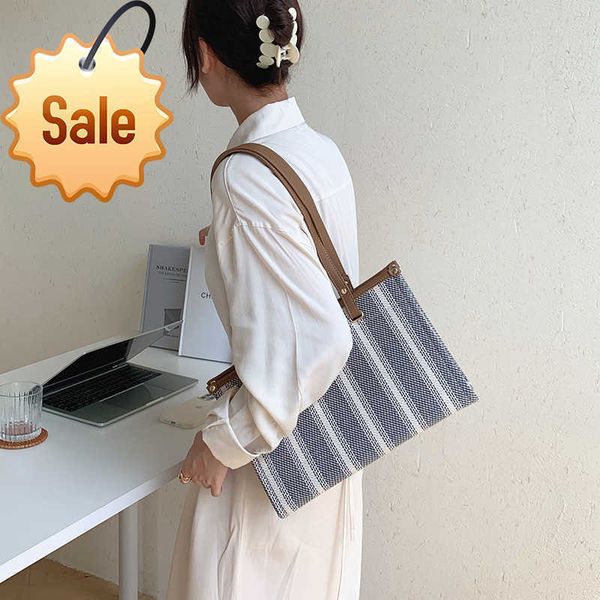 

women's designer bags triumphal arch capacity handheld shoulder bag minority color contrast stripe canvas advanced sensation commuter t