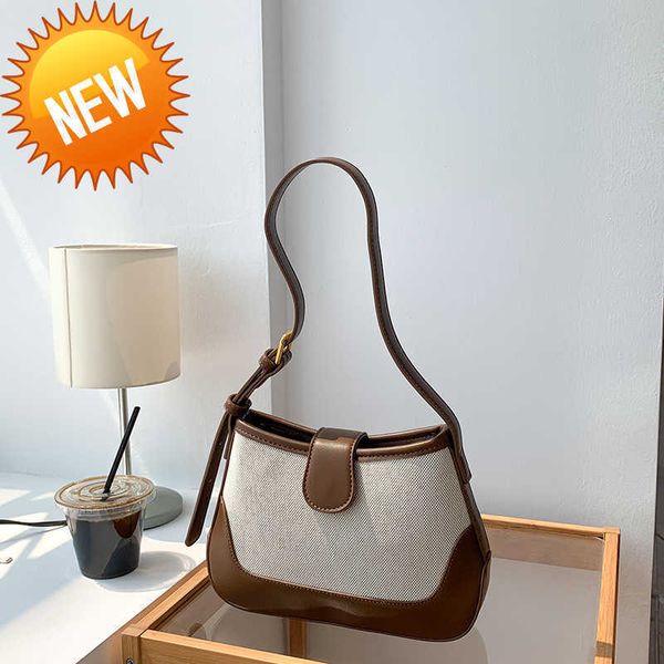

luxury designer bags autumn hand female minority triumphal arch underarm high sense shoulder ins female fashion splicing canvas factory dire