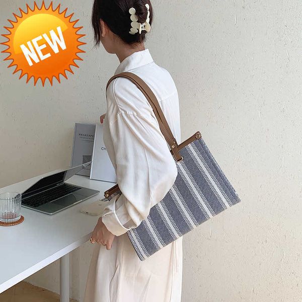 

luxury designer bags triumphal arch large capacity handheld tote bag women minority color contrast stripe canvas advanced sensation commuter