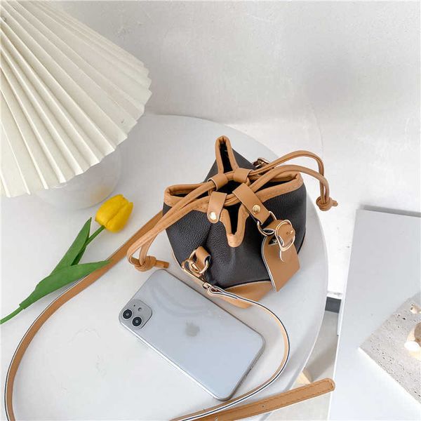 

autumn and winter new children's messenger bag drawstring bucket small letter printed one shoulder change outlet purse
