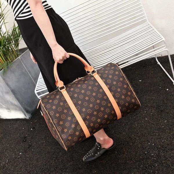 

2022 luxury fashion men women high-travel duffle bags brand designer luggage handbags with lock large capacity sport bag size55cm frame