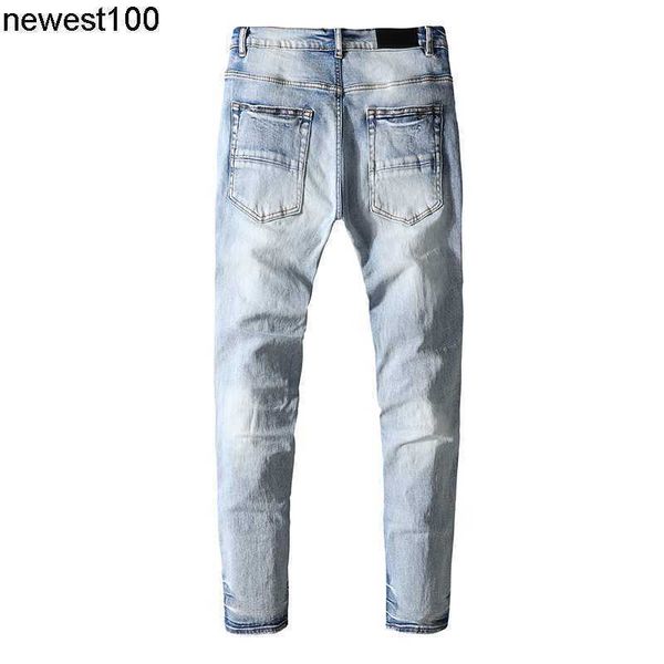 

men's designer jeans amirs jeans blue worn cashew nut flower patch cloth knee hole patch cloth small leg jeans