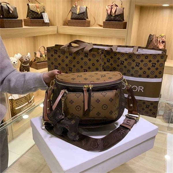 

70% off 2023 designer bag contrast color stitching texture backpack women's exquisite pendant single messenger hand