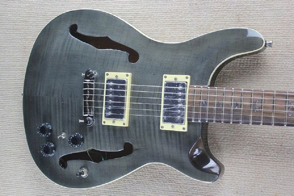 

grey electric guitar birds inlay fingerboard double f hole half a hollow