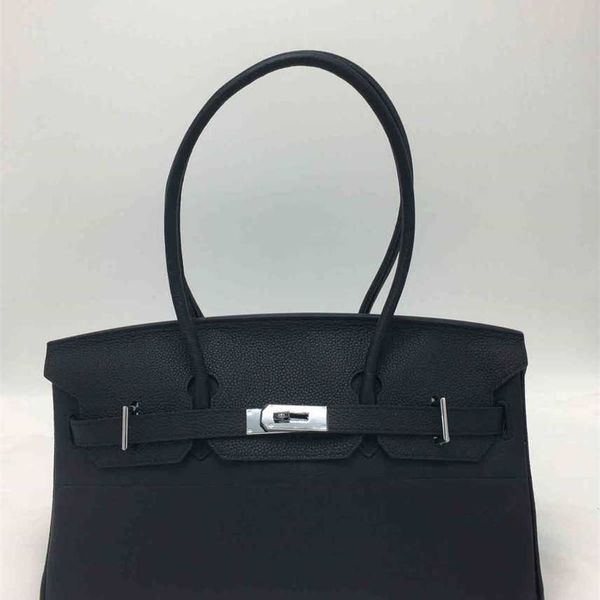 

a new leather lady's handbag large capacity simple handbag