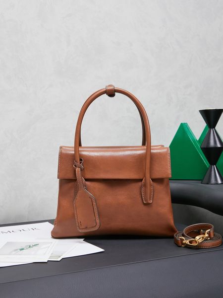 CW0140-New calfskin handbag with structured lines and refined details