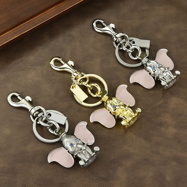 

Car keychain featuring a small metal elephant with cute ears that can move, a charming decorative item