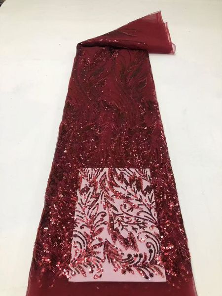 

Elegant Burgundy Sequin-Laced Tulle Ideal For Evening Dresses And Special Occasions.
