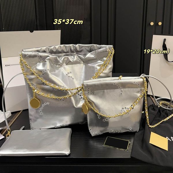 

Ladies Shoulder Evening Bags Hollow out Pattern Denim Leather Shopping Tote 19/35cm Gold Letters Coin Pendant Golden Hardware 22 Garbage Bag with Little Zipper Purse, Silver