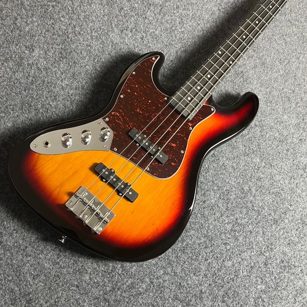 

Vintage Sunburst Offset Bass: Red-Marbled Pickguard, Dual Black Pickups & Silver Tuners