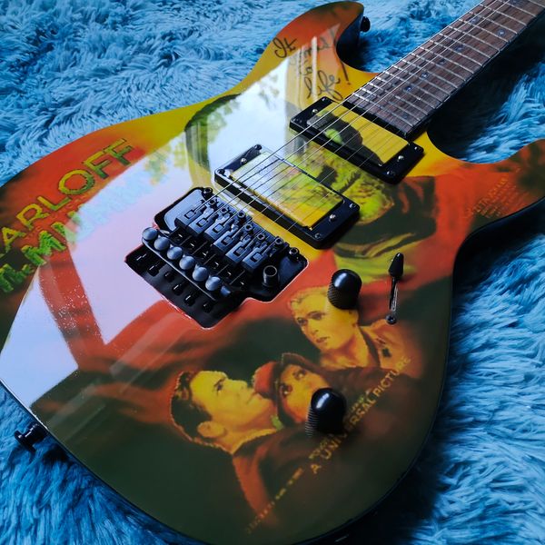 

Vivid Multicolor Artistic Guitar: Red/Yellow/Green Graphics, Dual Pickups & Tremolo Bridge