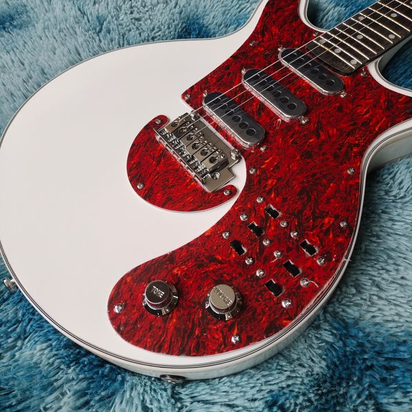 

Striking White/Red-Marbled Electric Guitar: 3 Black Pickups, Metallic Tremolo & Dark Fretboard