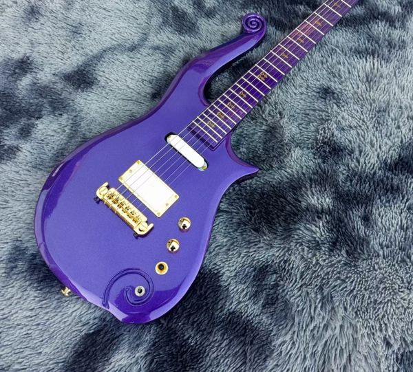 

Striking Glossy Purple Electric Guitar: Swirling Motifs, Gold Hardware & White Pickup