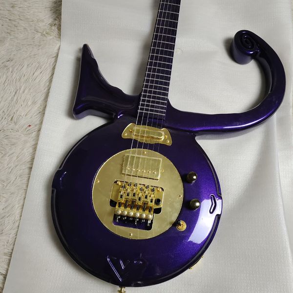 

Striking Round-Body Electric Guitar: Deep Purple Gloss, Gold Hardware & Curved Arm Design