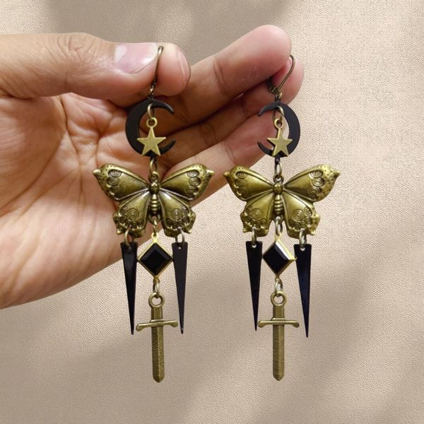 

Vintage Gothic Star Moon Butterfly Sword Earrings - Unique Retro Dangle Design for Bold Fashion Statements, Available for Wholesale