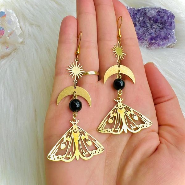 

Witchy Inspired Accessories: Artisanal Crescent Pendant and Insect Charm Pairing