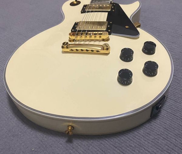 

Ivory White Single-Cut Guitar - Gold Hardware & Black Pickguard | Pro Humbuckers