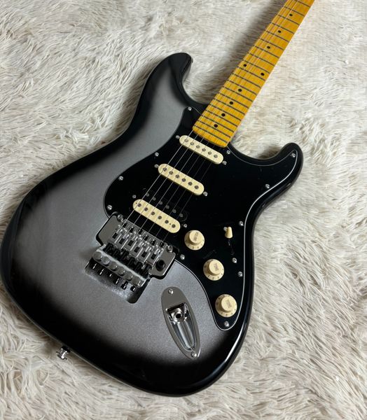 

Sleek Metallic Black Double-Cutaway Guitar: Cream Pickups, Silver Tremolo & Maple Neck