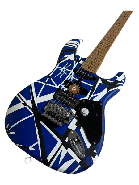 

Bold Blue/White/Black Geometric Double-Cutaway Guitar: Tremolo Bridge & Multiple Pickups