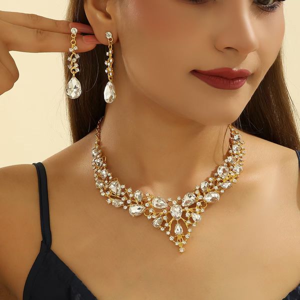 

Sophisticated Rhinestone Bridal Accessory Ensemble: Classic Teardrop Necklace/Ear Piercing Pair, Silver
