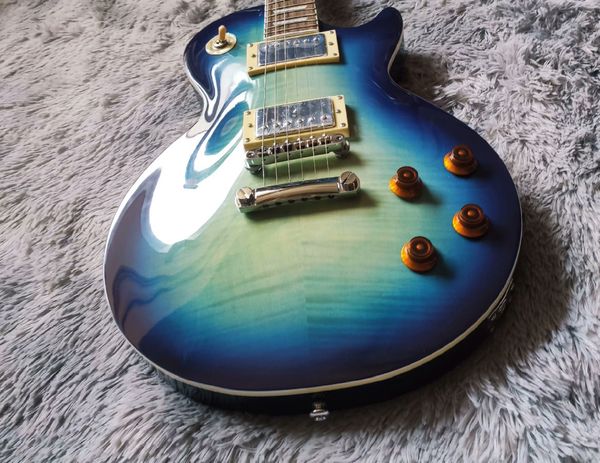 

Teal Burst Single-Cut Guitar - Dual Metallic Humbuckers & Orange Knobs | Stage-Ready