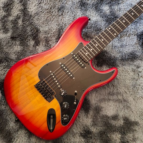 

Hot - Bold Blue/White/Black Geometric Double-Cutaway Guitar: Tremolo Bridge & Multiple Pickups