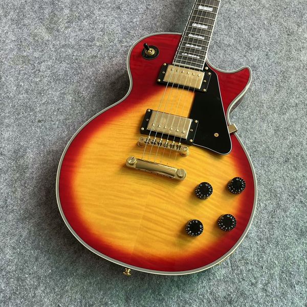 

Red-Yellow Sunburst Guitar: Gold Pickups, Black Guard & Rock-Ready Precision