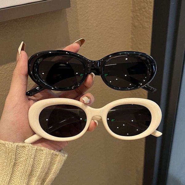 Oval white frame concave shaped sunglasses, taking photos of women with large faces, cat eyes, sun protection, advanced feel, ins, slimming
