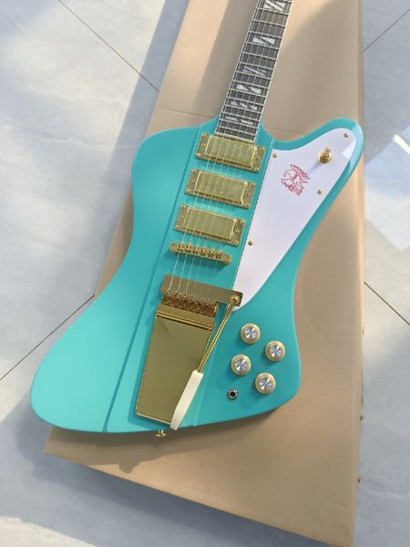 

Turquoise & Gold Electric Guitar - Triple Gold Pickups, Red Art Pickguard & Tremolo System