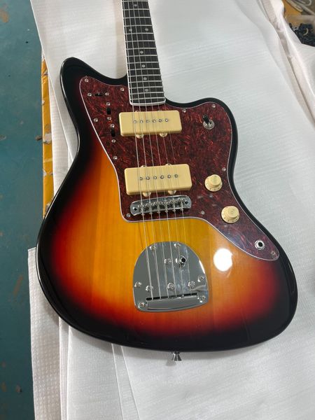 

Offset-Style Sunburst Guitar: Dark Brown to Orange-Yellow Gradient, Tortoiseshell Pickguard & Cream Humbuckers