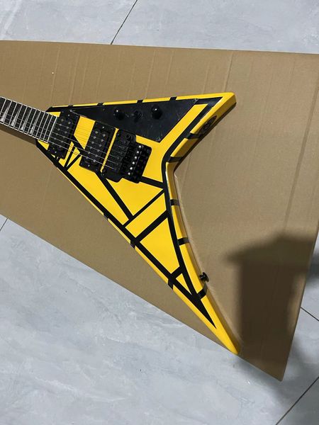 

Bold Flying V-Style Guitar: Vibrant Yellow Finish with Black Geometric Patterns & Dual Humbuckers