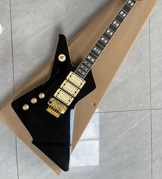 

Angular Avant-Garde Electric Guitar: High-Gloss Black Finish & Gold-Toned Hardware Contrast