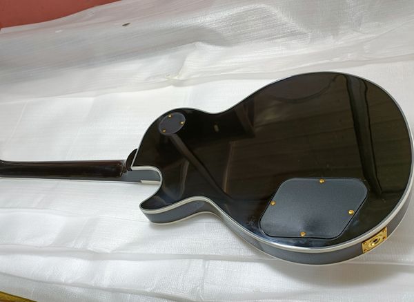 

Stunning Wooden Electric Guitar: Abalone Mythical Inlay, Gold-Plated Hardware, Natural Wood Grain