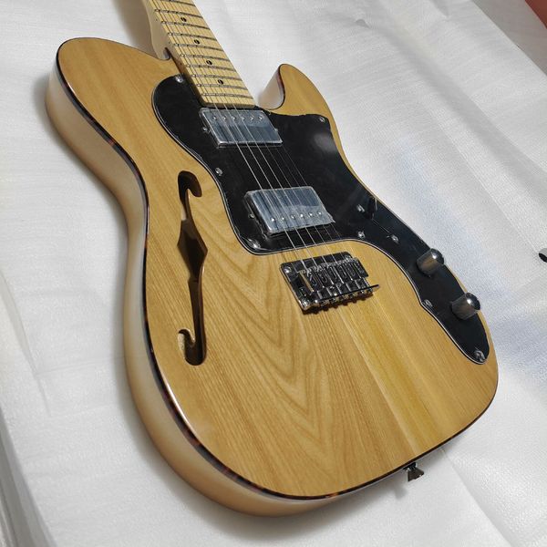 

Natural Wood Semi-Hollow Electric Guitar: Dual Humbuckers, Maple Neck, F-Hole Warmth