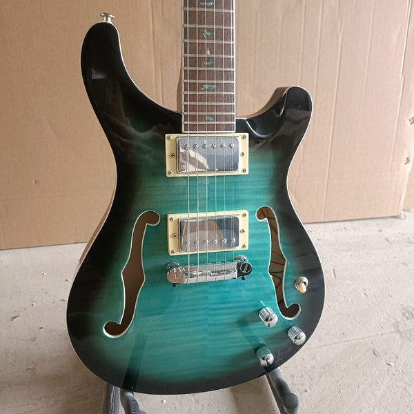 

Striking Gradient Green Semi-Hollow Guitar: Dual Humbuckers, Cream Frames, F-Holes