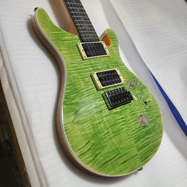 

Captivating Glossy Green Electric Guitar: Quilted Maple Top, Cream Humbuckers, Black Tremolo Bridge