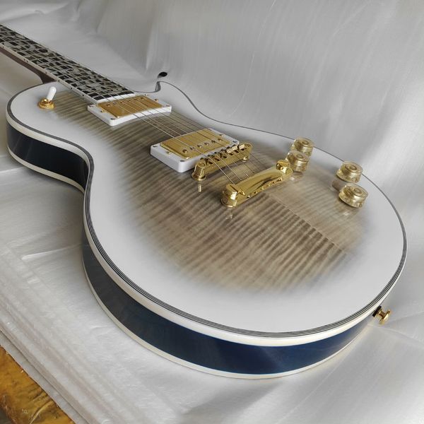 

Striking White-to-Gray Gradient Single-Cut Electric: Gold Humbuckers, White Pickguards, Gold Hardware