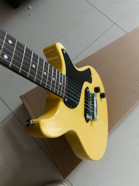 

Vibrant Glossy Yellow Electric Guitar: Single-Cutaway, Black Pickguard, Metallic Fixed Bridge
