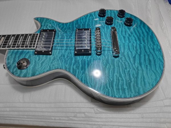 

Striking Turquoise Quilted Single-Cut Electric Guitar w/ Metallic Humbuckers, Black Pickguard & White Binding