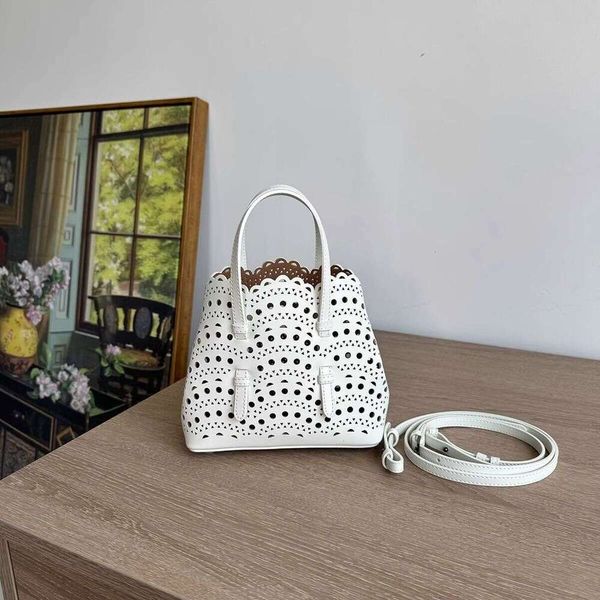 

Niche carved pattern design genuine leather handbag hollowed out cowhide crossbody fashionable shoulder vegetable basket bag women's bag, Black