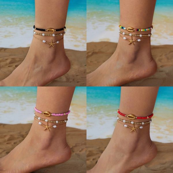 

Summer beach sea star shell bracelet in Bohemian style with pearl beads that can be layered together. Bracelet set.