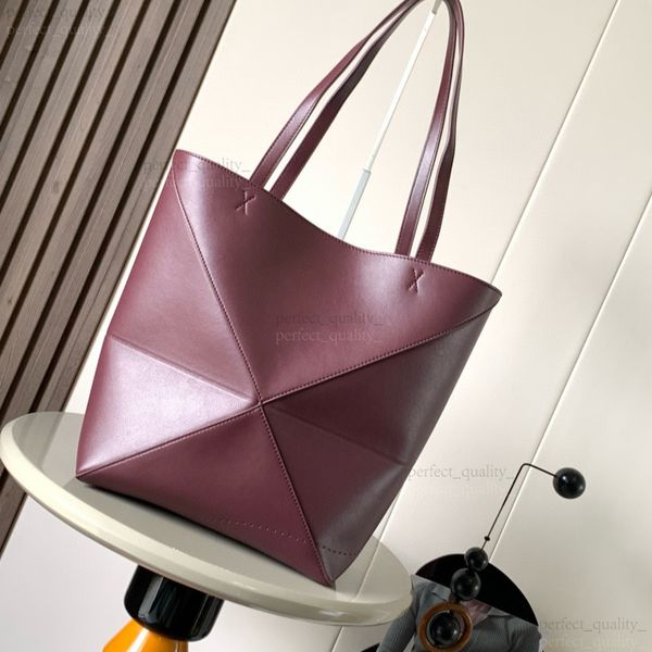 

99A The exquisite handbag designed by 12A, a masterpiece, features a single shoulder strap and is crafted from high-quality glossy cowhide with geometric patterns., One