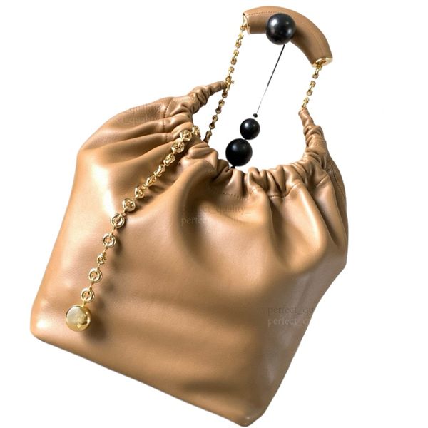 

Wearing a 99A designer-designed Napa sheepskin leather handbag with a shoulder strap, showcasing the elegance and sophistication of high fashion., Two