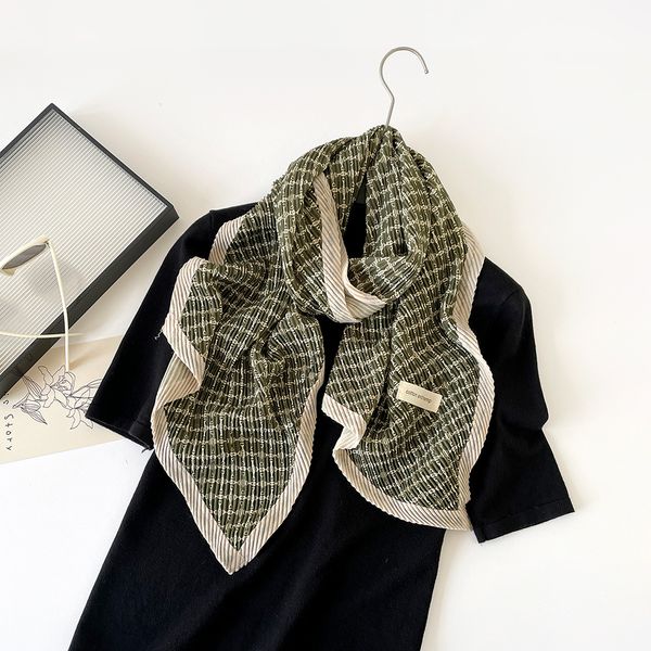 

New trendy Korean-style cotton-linen crepe scarf for women with printed design and double-layer cotton-linen decorative border, suitable as a shawl or headscarf.
