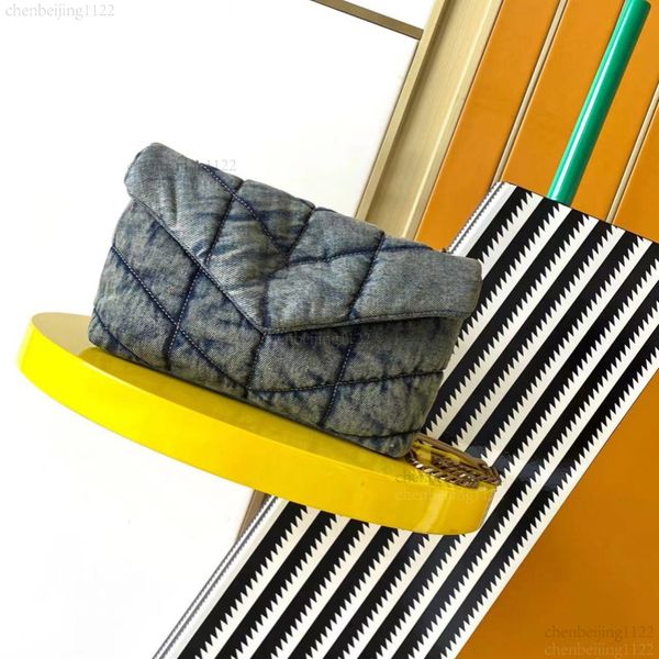 

99A The top designer crafted this hand-held crossbody bag with high-quality leather. The bag features canvas with exquisite hardware and measures 23 centimeters in, One