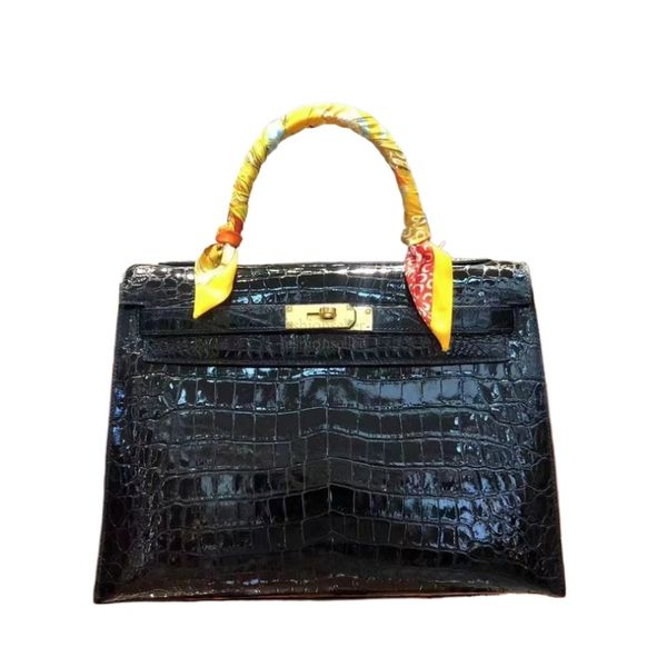 99A This top-quality handbag is made of natural South African crocodile skin and is adorned with exquisite metal accessories. It is a custom product with a capacity of